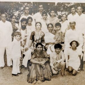 In an old family photo, Vidita sits in the arms of her beloved grandmother