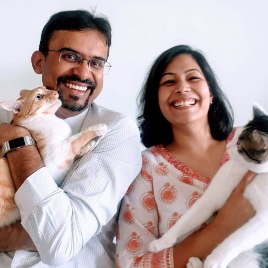 With her husband, Sumeet Yamdagni and their cats (1)